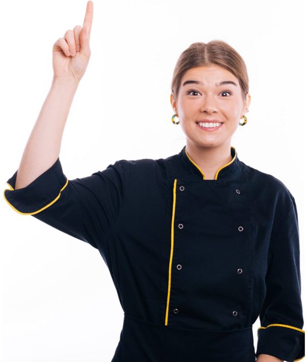 Phoo of young woman, young cook, smiling at camera and pointing up over white background