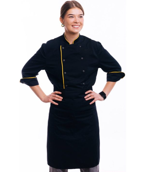 Portrait of happy confident young chef woman standing over white background and looking away